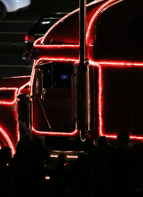 Sideview Coca-Cola Christmas truck at darkness