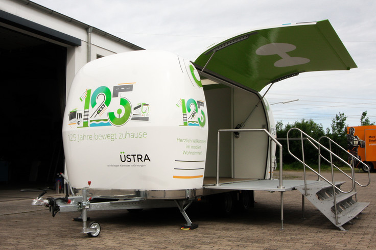 Side view of a set up Uestra promotion trailer Image 6