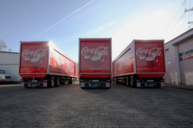 Backside of three Coca-Cola Christmas Trucks Image 2