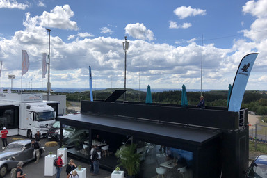 from from above on clouds and the Isdera Showroom in black Image 9
