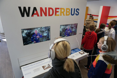 A group of people using headsets inside the Wanderbus Image 20
