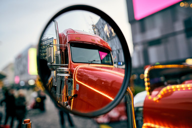 Rearview mirror of a Coca Cola truck Image 10