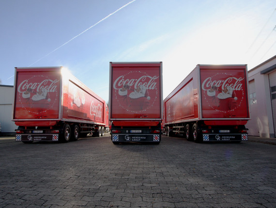 What do the Coca Cola trucks actually do in the summer?