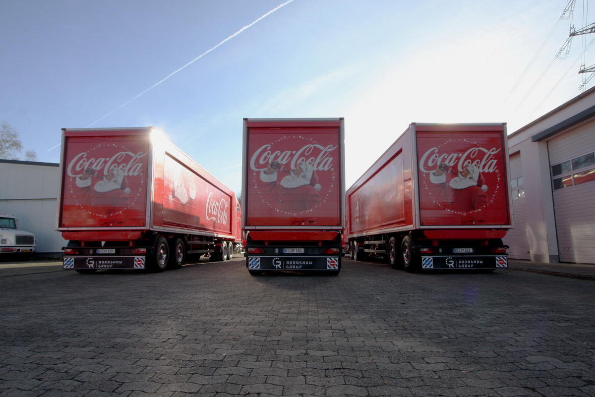 What do the Coca Cola trucks actually do in the summer?