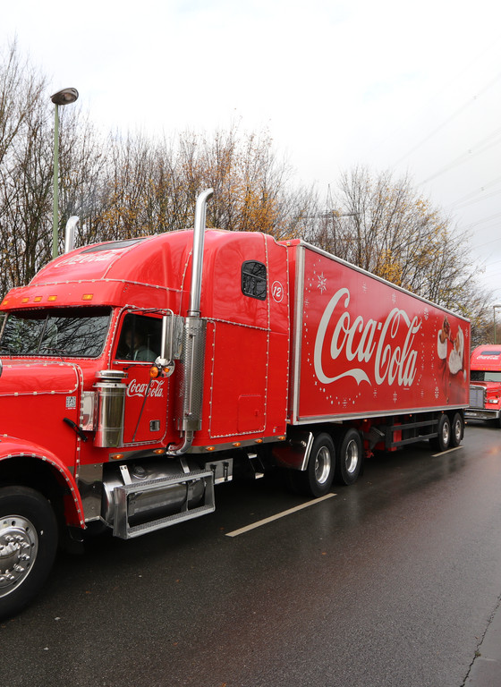Kolonne mit 3 Coca-Cola Trucks
